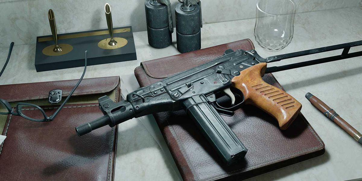 Screenshot of OTs 9 submachine gun on top of notebook placed on white desk near pen