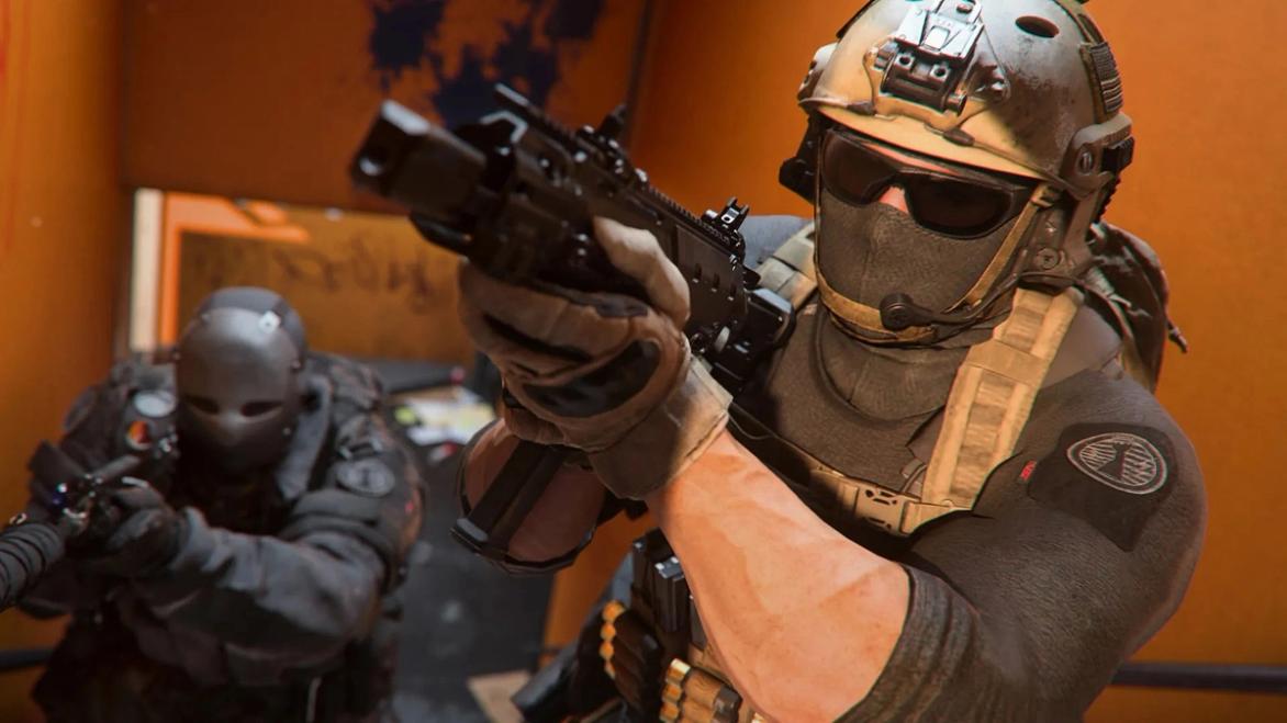 Screenshot of Modern Warfare 2 players moving up staircase and aiming down sights of guns